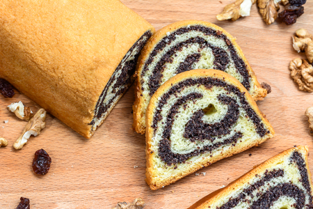 Poppy seed cake on wooden board.の写真素材