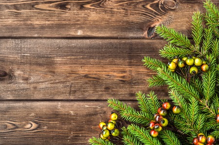 Green christmas tree on wooden backgroundの写真素材