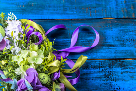 Easter decoration from easter eggs, easter boxwood and flowers.の写真素材