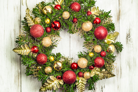 Christmas wreath with baubles on wooden tableの写真素材
