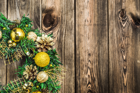 Christmas wreath with baubles on wooden tableの写真素材