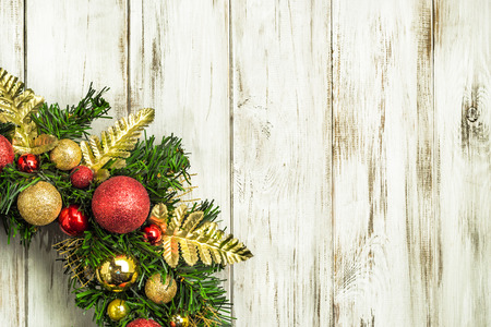 Christmas border from christmas wreath on wooden tableの写真素材