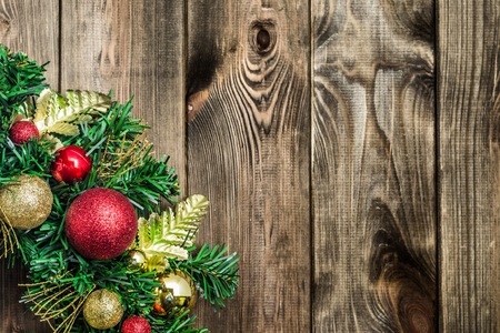 Christmas border from christmas wreath on wooden tableの写真素材