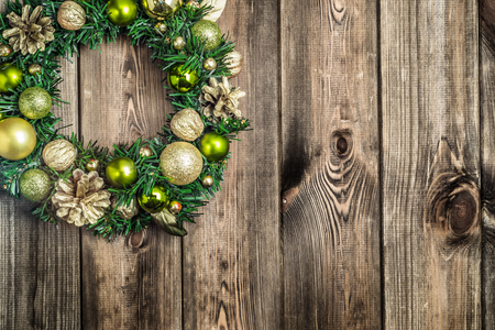 Christmas border from christmas wreath on wooden tableの写真素材