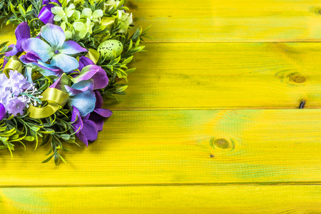Easter decoration from easter eggs, easter boxwood and flowers.の写真素材
