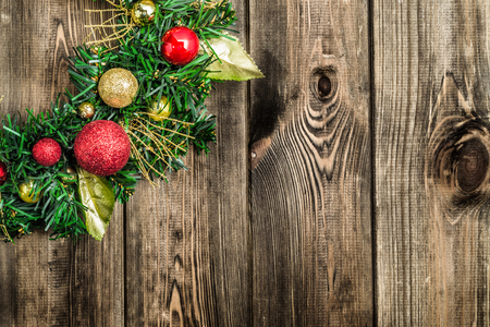 Christmas border from christmas wreath on wooden tableの写真素材