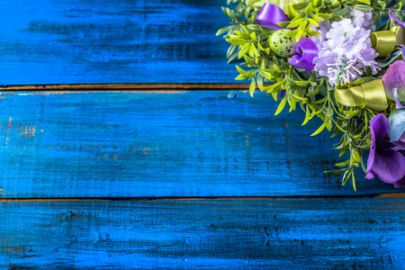 Easter decoration from easter eggs, easter boxwood and flowers.の写真素材