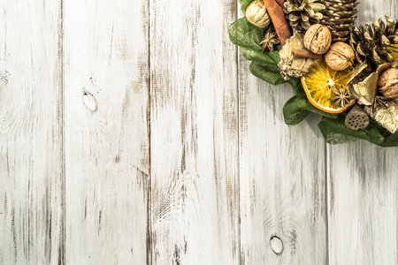 Christmas wreath with dried fruits on wooden tableの写真素材