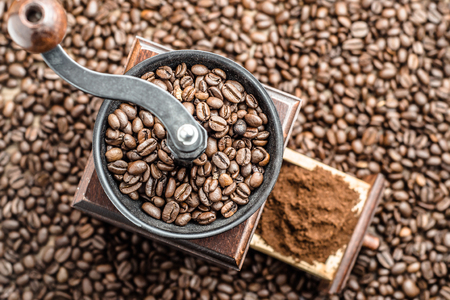 Coffee grinder and coffee beans backgroundの写真素材