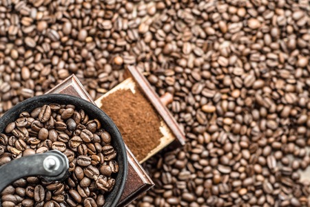 Coffee grinder and coffee beans backgroundの写真素材