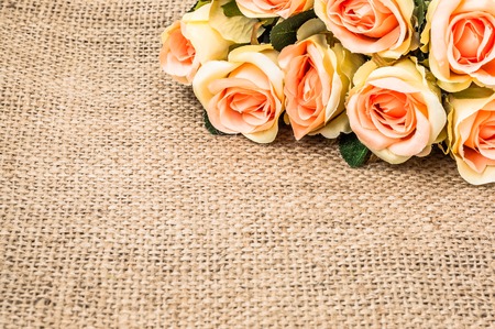 Pink roses on rustic background. Flowers frame, floral greeting card.の写真素材