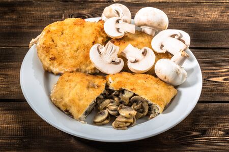 Fried chicken kiev from chicken breast stuffed with mushrooms, homemade cooking conceptの写真素材