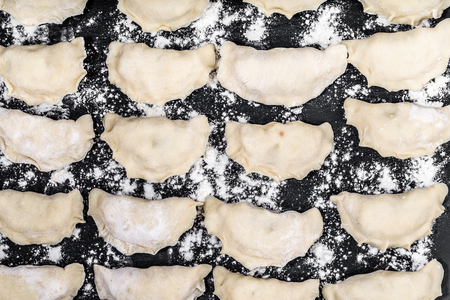 Raw dumplings background, cooking homemadeの写真素材
