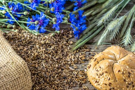 Fresh baked bread rolls on rustic wooden table, bakery products backgroundの写真素材