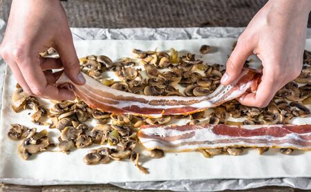 Filling dough with a stuffing. Preparing puff pastry rolls, baking conceptの写真素材