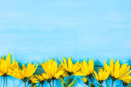 Yellow flowers frame useful as mothers day card or wedding invitationの写真素材