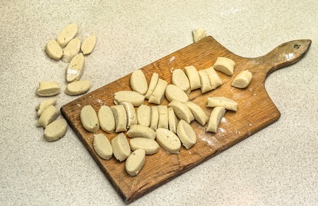 Raw potato dumplings prepared for cooking.の写真素材