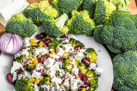 Broccoli salad with vegetables and feta cheese.の写真素材