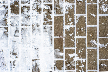 Background with snow on pavement in winter, texture