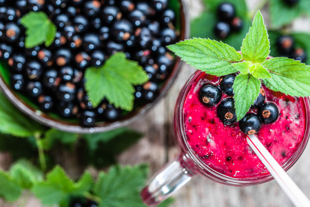 Healthy smoothie from fruits with yogurt. Blended berry of blackcurrant vitamin drink, summer desserts conceptの写真素材