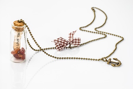 Youth pendant made with glass bottle and chain, female jewelry and fashionの写真素材