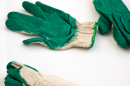 Green gardening gloves on white backgroundの写真素材