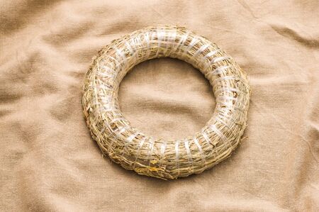 Round wreath from hay for christmas decorationの写真素材