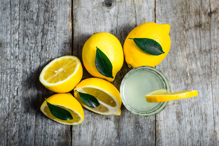 Glass of lemon juice with water - lemonade, detox drink, overheadの写真素材