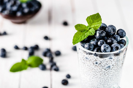 Chia pudding with berries and milk, sweet nourishing dessert, healthy breakfast superfood conceptの写真素材