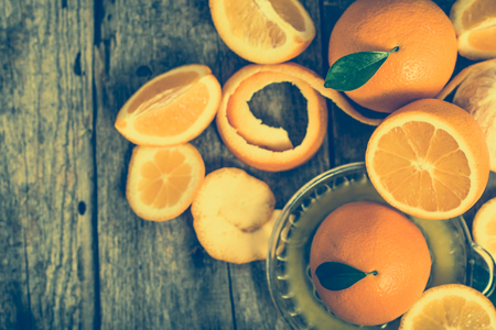 Squeezed orange juice and fresh oranges fruits, overhead, flat layの写真素材