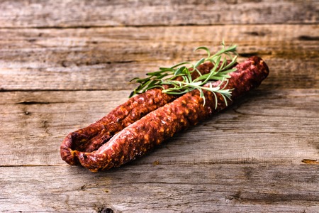 Tapas from spain, chorizo sausage or salami pepperoni, traditional spanish food on wooden table.の写真素材