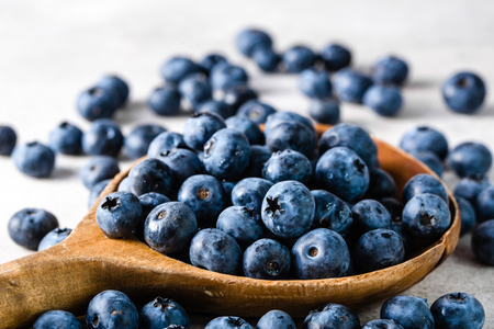 Blueberries. Spoon with berries isolated on white background.の写真素材