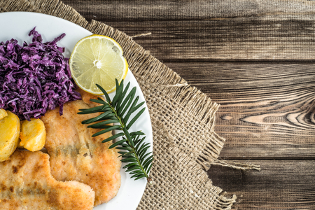 Traditional dinner, fried salmon, potatoes and vegetables.の写真素材