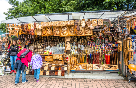 ZAKOPANE, POLAND - AUGUST 17, 2016: Street trading in the city center of Zakopane - sale of tourist souvenirs - people buying homemade regional product and handicraftのeditorial素材
