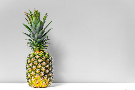 Tropical fruit, fresh pineapple on tableの写真素材