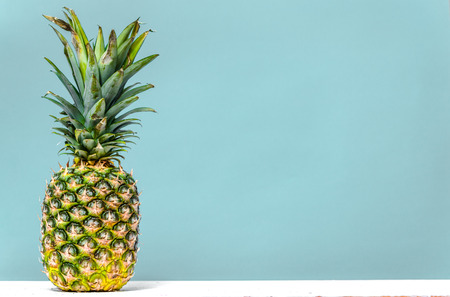 Ripe pineapple isolated on gray backgroundの写真素材