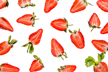 Fresh fruit pattern. Strawberry slices isolated on white background.の写真素材