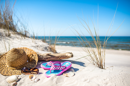 Summer vacation landscape with beach accessories, sand and sea view, Baltic, Polandの写真素材