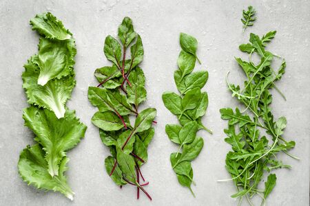 Fresh green salad, leaves of beets, spinach, lettuce and arugula. Vegetarian diet, healthy food concept.の写真素材