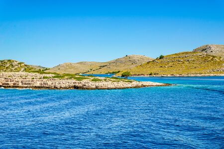 Beautiful seascape, scenic view of islands in the sea. Mediterranean landscape of island beach with rocky coast in Croatia. Vacation travel destination.の写真素材