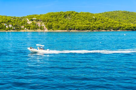 Kornati near Zadar, Croatia - AUG 18, 2019: Scenic view of bay Mediterranean Sea and speed boat at the coast of lagoon with with turquoise water, paradise island in Dalmatia, Croatia, Europeのeditorial素材