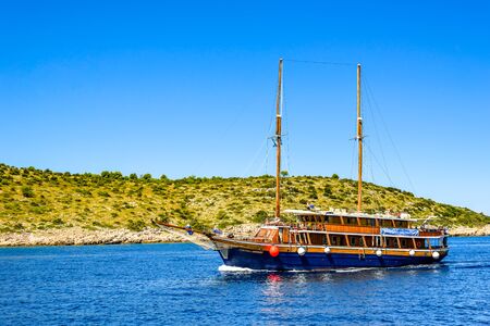Archipelago Kornati, near Zadar, Dalmatia, Croatia - AUG 18, 2019: Sailboat in the sea. Cruise yacht or sail boat, sailing in the sea. Yachting, luxury vacation and travel concept.のeditorial素材