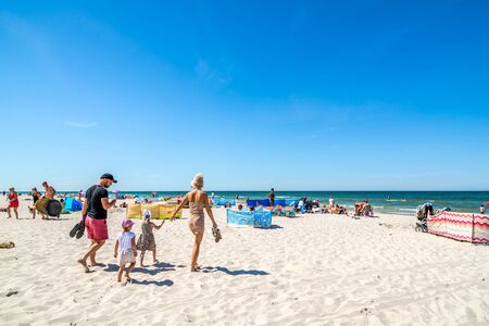 LEBA, POLAND - JUNE 09, 2019: People on the beach, summer vacation concept with sunbathing over sea and blue skyのeditorial素材