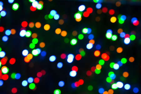 Festive Christmas lights background. Blurred pattern - bokeh with light.