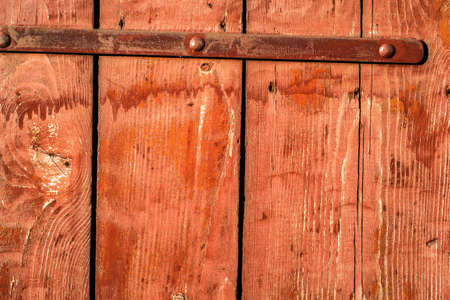 Background texture of wooden planks painted in red color.の写真素材