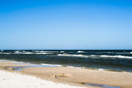Landscape with sea view, sandy beach and summer blue sky, Leba, Baltic Sea, Poland, nature backgrounds.の写真素材