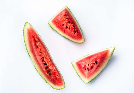 Slices of watermelon isolated on white background, top view. Summer fruit close-up.