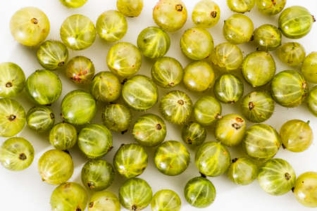 Gooseberries fruits on white background. Ripe summer fruits background.の写真素材