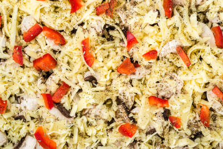 Close-up of homemade pizza with cheese, mushrooms champignons and paprika. Food background, top view.の写真素材