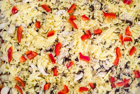 Close-up of homemade pizza with cheese, mushrooms champignons and paprika. Food background, top view.の写真素材
